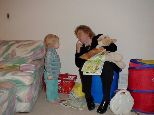 My big sister receiving instruction from aunt M. L. on how to be a good big sister!  Taken Nov. 8, 2001.