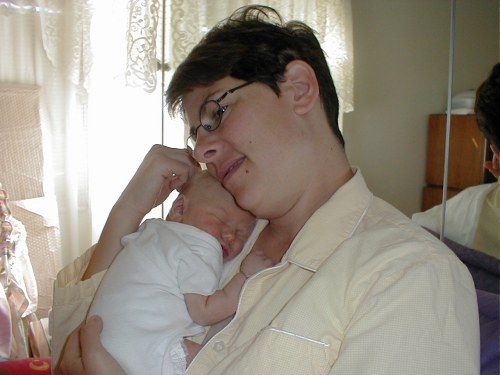 Me asleep on Mommy at home.  Taken Nov. 9, 2001.