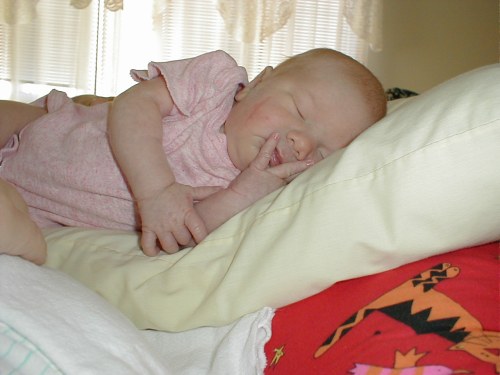 Me asleep on Mommy's pillow.  Taken Nov. 10, 2001.